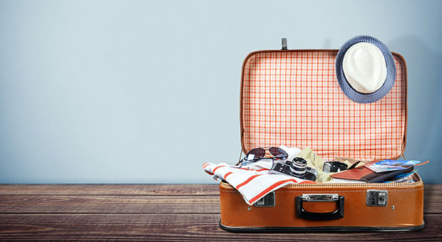 Bevor ein Mitarbeiter den Koffer packt, sollte er seine Urlaubsplanung mit dem Arbeitgeber abstimmen.